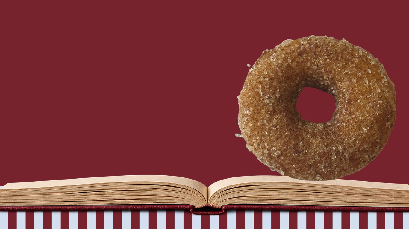 Cinnamon sugar mini donut on an open storybook, The Hole Story mini donut catering in Oklahoma City
